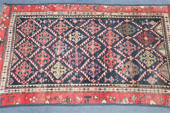 A Caucasian blue ground rug 157 x 88cm